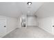 Bonus room with neutral paint and carpet, featuring access to the attic at 151 S Harper Faith Way, Benson, NC 27504