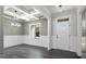 Well-lit dining room showcasing coffered ceilings, wainscoting details, and beautiful dark wood floors at 151 S Harper Faith Way, Benson, NC 27504