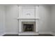 Living room fireplace has white tile surround and granite hearth at 151 S Harper Faith Way, Benson, NC 27504