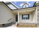 Elegant front entrance with brick steps and a covered porch, showcasing the home's address at 151 S Harper Faith Way, Benson, NC 27504