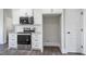 Kitchen featuring white cabinets, granite countertops, and stainless steel appliances at 151 S Harper Faith Way, Benson, NC 27504