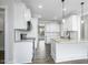 Bright kitchen featuring white cabinets, granite countertops, and stainless steel appliances at 151 S Harper Faith Way, Benson, NC 27504