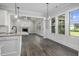 Open concept kitchen and dining area with hardwood floors and lots of natural light at 151 S Harper Faith Way, Benson, NC 27504
