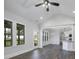 Bright living room with eating area and kitchen features lovely wood floors at 151 S Harper Faith Way, Benson, NC 27504