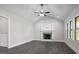 Living room with vaulted ceiling features a fireplace and large windows at 151 S Harper Faith Way, Benson, NC 27504