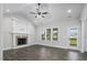 Spacious living room features wood floors and vaulted ceilings and fireplace at 151 S Harper Faith Way, Benson, NC 27504