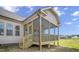 Exterior side view of a home featuring a screened-in back porch at 151 S Harper Faith Way, Benson, NC 27504