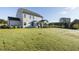 Expansive backyard with a well-maintained lawn and a covered patio, perfect for outdoor entertaining at 1515 Willbrook Dr, Fuquay Varina, NC 27526