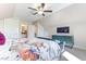 Spacious bedroom with a ceiling fan, television, and storage at 1515 Willbrook Dr, Fuquay Varina, NC 27526