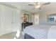 Bright bedroom featuring natural light, closet, and patterned bedspread at 1515 Willbrook Dr, Fuquay Varina, NC 27526