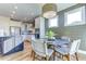 Bright dining area features modern lighting, wood floors, and a shiplap accent wall at 1515 Willbrook Dr, Fuquay Varina, NC 27526