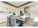 Elegant dining room featuring modern decor, wainscoting, and ample natural light at 1515 Willbrook Dr, Fuquay Varina, NC 27526