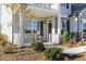 Charming covered front porch offers a cozy seating area and attractive landscaping at 1515 Willbrook Dr, Fuquay Varina, NC 27526