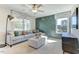 Comfortable living room with plush seating, decorative pillows, and natural light from the large windows at 1515 Willbrook Dr, Fuquay Varina, NC 27526