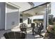 Covered patio with outdoor seating and a view of the grassy backyard at 1515 Willbrook Dr, Fuquay Varina, NC 27526