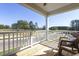 Charming porch overlooking a green community with comfortable seating to enjoy an outdoor atmosphere at 1515 Willbrook Dr, Fuquay Varina, NC 27526
