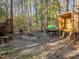 Backyard recreation area with outbuilding, fire pit, and seating at 182 Mill Bend Dr, Fuquay Varina, NC 27526