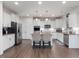 Kitchen featuring stainless steel appliances, white cabinets, and an island with bar seating at 182 Mill Bend Dr, Fuquay Varina, NC 27526