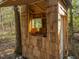 Exterior view of outbuilding with chairs inside and a wooded setting at 182 Mill Bend Dr, Fuquay Varina, NC 27526