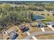 Scenic aerial view of a neighborhood featuring homes nestled among trees, with a pond nearby at 182 Prince Place Dr, Fuquay Varina, NC 27526