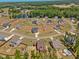 Stunning aerial view showcasing homes in a community setting with large lots and scenic surroundings at 182 Prince Place Dr, Fuquay Varina, NC 27526