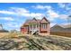The backyard shows a large, undeveloped yard, offering a blank canvas for creating your dream outdoor space at 182 Prince Place Dr, Fuquay Varina, NC 27526