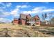 Captivating shot of the backyard featuring a charming screened porch and ample space for outdoor enjoyment at 182 Prince Place Dr, Fuquay Varina, NC 27526