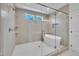 Bathroom featuring walk-in shower, freestanding tub, recessed lighting, and frameless glass door at 182 Prince Place Dr, Fuquay Varina, NC 27526