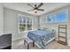Inviting bedroom with large windows, soft carpet, and neutral color scheme at 182 Prince Place Dr, Fuquay Varina, NC 27526