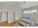 Spacious bedroom features a neutral color scheme, walk-in shower, and vaulted ceilings with fan at 182 Prince Place Dr, Fuquay Varina, NC 27526