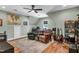 Versatile bonus room featuring hardwood floors, ceiling fan, and ample space for recreation and relaxation at 182 Prince Place Dr, Fuquay Varina, NC 27526