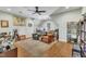 Spacious bonus room showcasing a ceiling fan, hardwood floors, and a flexible layout for various activities at 182 Prince Place Dr, Fuquay Varina, NC 27526
