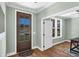 Bright entryway featuring a wood-framed glass door and hardwood floors at 182 Prince Place Dr, Fuquay Varina, NC 27526