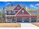 Charming two-story home with a welcoming porch and a three-car garage at 182 Prince Place Dr, Fuquay Varina, NC 27526