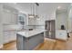 Beautiful kitchen with white cabinets, stainless steel appliances, and a center island at 182 Prince Place Dr, Fuquay Varina, NC 27526