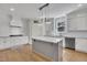 Bright kitchen with a center island, modern appliances, and subway tile backsplash at 182 Prince Place Dr, Fuquay Varina, NC 27526