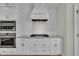 Modern kitchen features white shaker cabinets, stainless steel appliances, granite countertops, and white subway tile backsplash at 182 Prince Place Dr, Fuquay Varina, NC 27526