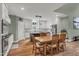 Spacious kitchen featuring a dining area, white cabinets and stainless steel appliances at 182 Prince Place Dr, Fuquay Varina, NC 27526