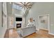 Inviting living room with a fireplace, high ceilings, and hardwood floors at 182 Prince Place Dr, Fuquay Varina, NC 27526