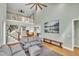 Bright, open living room with high ceilings, staircase, and access to dining area with modern, neutral decor at 182 Prince Place Dr, Fuquay Varina, NC 27526