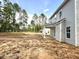View of the back of the house and large back yard at 187 Regis Ln # 10, Coats, NC 27521
