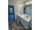 Bathroom featuring a double sink vanity and large mirror at 187 Regis Ln # 10, Coats, NC 27521