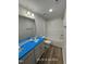 Bright bathroom featuring double sinks with laminate wood flooring and a shower-tub combo with white tiling at 187 Regis Ln # 10, Coats, NC 27521