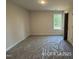 A bright bedroom featuring a window and closet space at 187 Regis Ln # 10, Coats, NC 27521