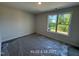 Bedroom with a large window offering natural light at 187 Regis Ln # 10, Coats, NC 27521