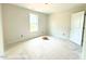 Unfinished bedroom with a window, a closet door, and a blank walls and flooring ready for finishing touches at 187 Regis Ln # 10, Coats, NC 27521