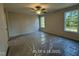 A bright bedroom offers ample natural light through two windows at 187 Regis Ln # 10, Coats, NC 27521