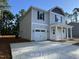 Two-story home with a one-car garage, newly installed vinyl siding, and a concrete driveway at 187 Regis Ln # 10, Coats, NC 27521