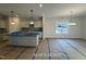 A well-lit open concept kitchen includes an island and modern light fixtures at 187 Regis Ln # 10, Coats, NC 27521