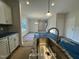 Open concept shows the island sink and view to the dining and living areas at 187 Regis Ln # 10, Coats, NC 27521